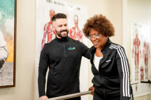 Senior woman after stroke doing physical therapy exercises with a physical therapist