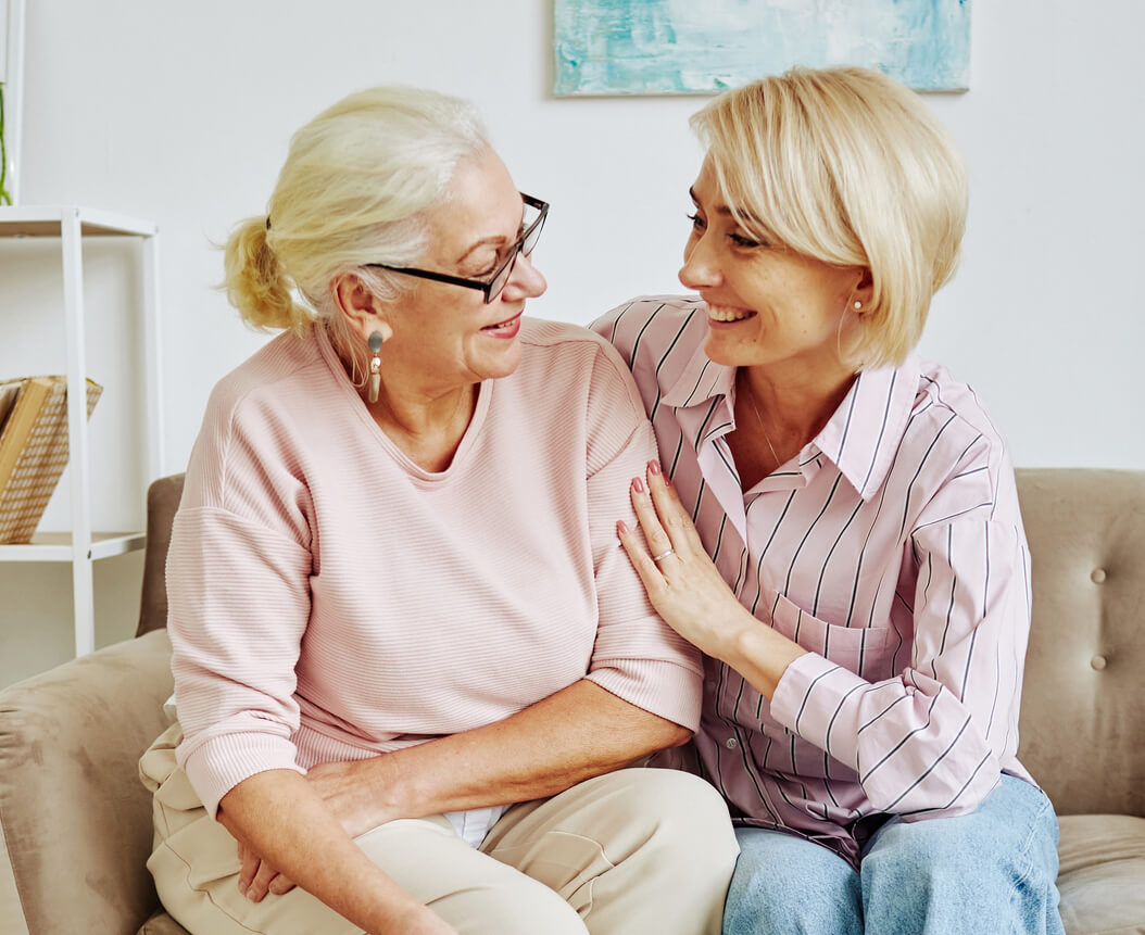 Adult Child talking with Senior Mother