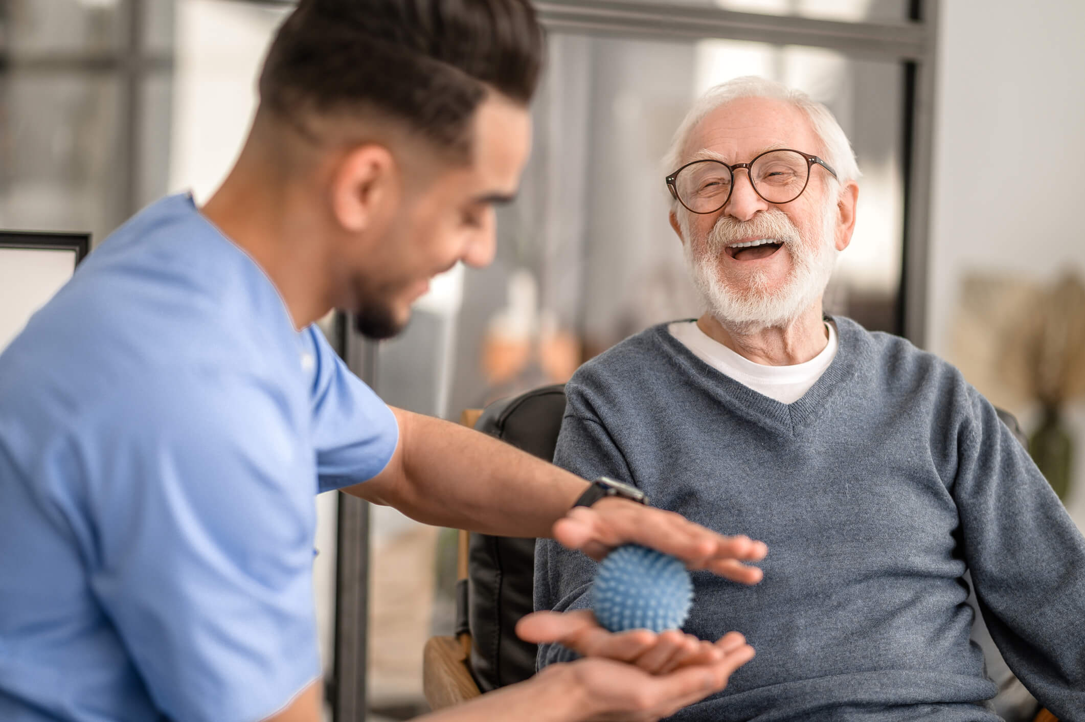 Male therapist having one-on-one touch point with male patient