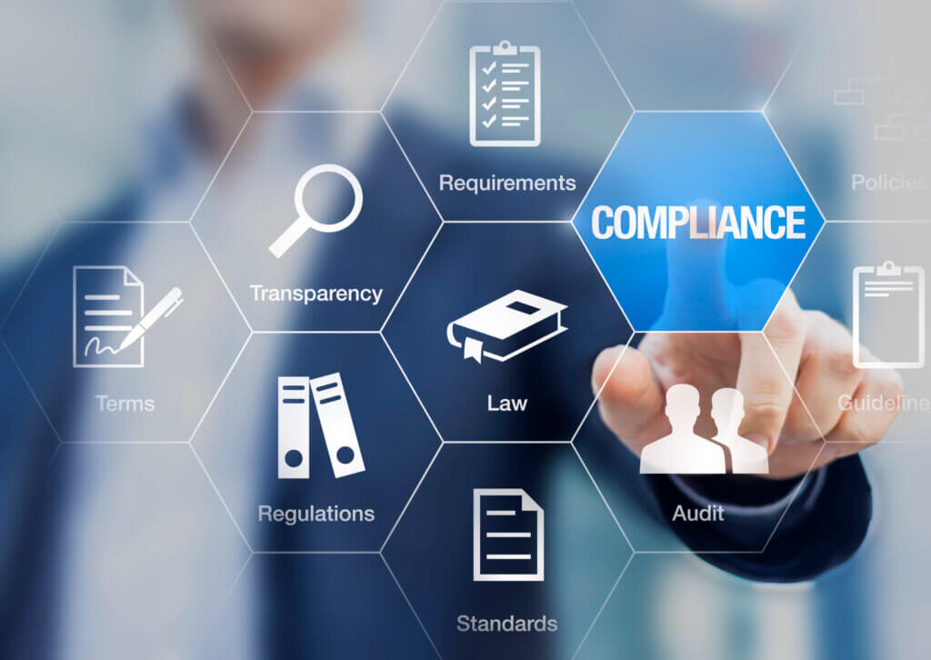 Compliance concept with icons for regulation requirements on a virtual screen with a staff member touching a button