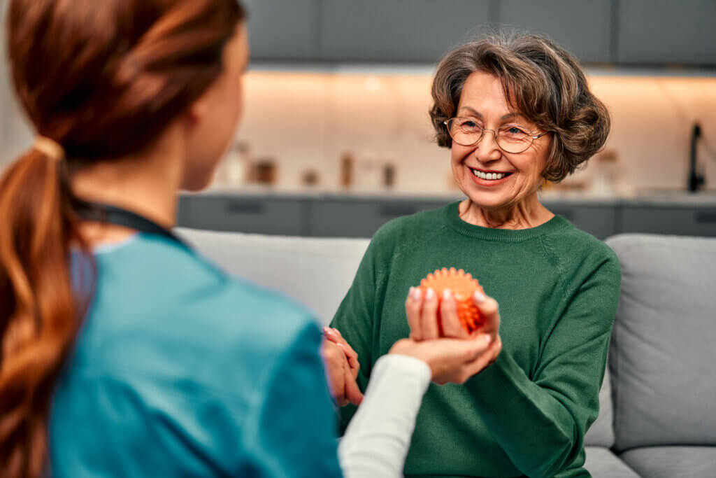 woman holding a spiked ball in her hand for pain management